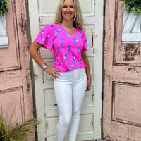 Lulu-B Short Sleeve V-Neck Frill Top in Seahorse Hot Pink with SPF 50 fabric, breathable comfort, and frill details for a stylish, sun-safe look.