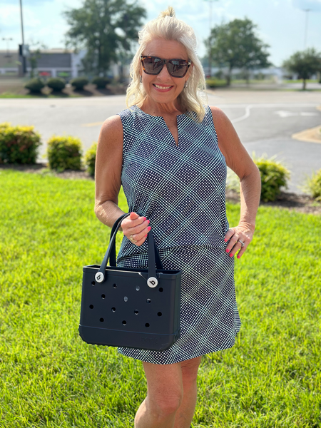 Sleek, stylish, and sun-smart — this Sleeveless Keyhole Top is made from a soft 92% Nylon and 8% Spandex blend for a comfortable stretch fit. It features a flattering V-neckline with a keyhole detail, a straight hemline, and a 23-inch center length. Pre-shrunk for consistent sizing and offering UPF 50 sun protection, it's perfect for warm-weather outings. Easy to care for—just machine wash and hang dry.

