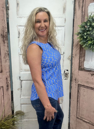 The Sleeveless Key Hole Top is the perfect blend of style, comfort, and function. Crafted from a lightweight, stretchy nylon blend, this top features a flattering V-neckline with a chic keyhole detail and a straight hem for an easy, polished silhouette. Pre-shrunk for a consistent fit and designed with UPF50 sun protection, it’s ideal for sunny days, travel, or everyday wear—keeping you cool while looking effortlessly put together.

Pattern Features: Blue/Black/White geometric pattern