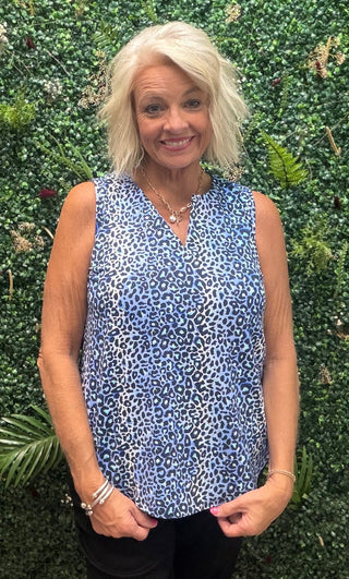 Fabric | Nylon-spandex blend — lightweight, stretchy, and breathable
Fit | Relaxed through the body
Neckline | Keyhole
Sleeves | Sleeveless
Color | Blue Leopard
Sun Protection | UPF 50+