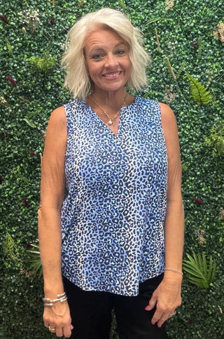 Fabric | Nylon-spandex blend — lightweight, stretchy, and breathable
Fit | Relaxed through the body
Neckline | Keyhole
Sleeves | Sleeveless
Color | Blue Leopard
Sun Protection | UPF 50+