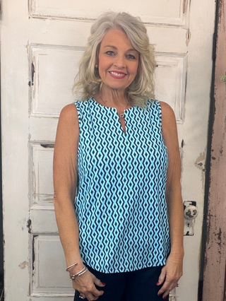 Sleeveless Key Hole Top - RPNY
The Sleeveless Key Hole Top is the perfect blend of style, comfort, and function. Crafted from a lightweight, stretchy nylon blend, this top features a flattering V-neckline with a chic keyhole detail and a straight hem for an easy, polished silhouette. Pre-shrunk for a consistent fit and designed with UPF50 sun protection, it’s ideal for sunny days, travel, or everyday wear—keeping you cool while looking effortlessly put together.