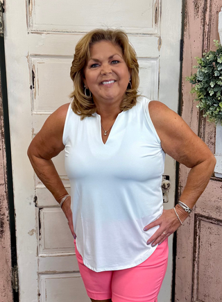Crafted from 92% Nylon and 8% Span materials, this Sleeveless Key Hole Top boasts a stylish V neckline and a straight hemline for a flattering silhouette. Pre-shrunk for the perfect fit, it also offers UPF50 sun protection and measures 23 inches at the center. Machine wash and hang dry for easy maintenance.
