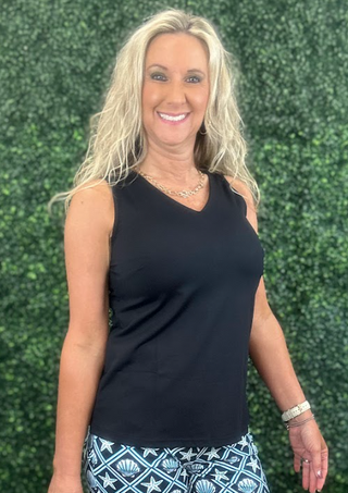 Stay cool, comfortable, and effortlessly stylish in this Lulu-B Sleeveless V-Neck Top. Made with lightweight, breathable SPX fabric, it offers all-day comfort with premium UPF50+ sun protection. The cooling, quick-drying material moves with you, making it perfect for everyday wear, travel, outdoor activities, or layering.