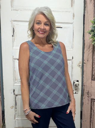 Sleek, simple, and effortlessly stylish! This sleeveless tank is made from a soft, stretchy 92% Nylon / 8% Spandex blend and features a classic tank neckline with a straight hemline. With a center back length of 24 inches and pre-shrunk fabric, it offers a flattering fit that lasts. Easy to care for—just machine wash and wear again and again!