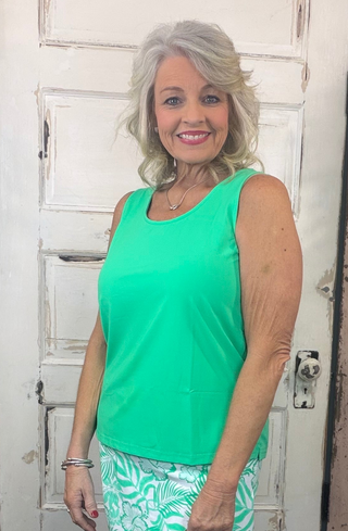 Sleek, simple, and effortlessly stylish! This sleeveless tank is made from a soft, stretchy 92% Nylon / 8% Spandex blend and features a classic tank neckline with a straight hemline. With a center back length of 24 inches and pre-shrunk fabric, it offers a flattering fit that lasts. Easy to care for—just machine wash and wear again and again!