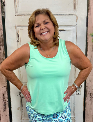 Sleeveless tank top made from soft stretchy nylon spandex fabric, classic tank neckline, straight hemline, 24-inch back length, pre-shrunk and machine washable for everyday comfort and layering.