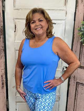 Sleeveless tank top made from soft stretchy nylon spandex fabric, classic tank neckline, straight hemline, 24-inch back length, pre-shrunk and machine washable for everyday comfort and layering.