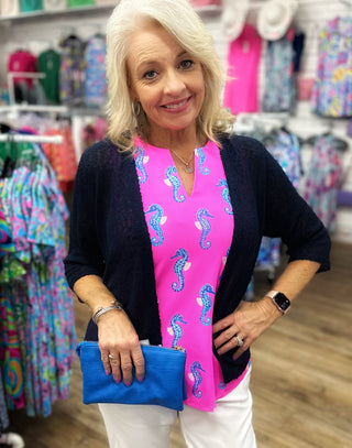 The Lulu-B Textured Cardigan in Navy features a beautiful woven pattern with a richly textured fabric in a deep, timeless navy hue — super lightweight construction provides breezy arm coverage without adding warmth, making it the perfect layer for warm-weather days when you want a clean, put-together look without the heat.