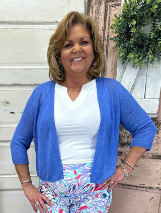 Stay stylish with this lightweight cardigan featuring a textured weave pattern. Perfect for summer, it offers great arm coverage without feeling too hot.