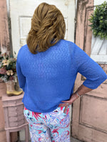 Stay stylish with this lightweight cardigan featuring a textured weave pattern. Perfect for summer, it offers great arm coverage without feeling too hot.
