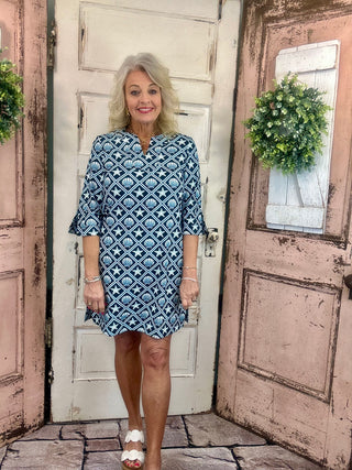 Lulu-B travel dress with SPF 50 sun protection, lightweight nylon spandex fabric, v-neckline, quarter sleeves, side slits, breathable and comfortable for travel, vacations, and everyday wear.