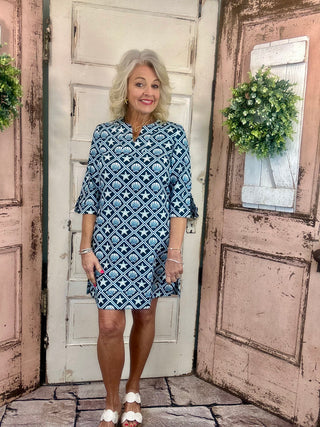 Lulu-B travel dress with SPF 50 sun protection, lightweight nylon spandex fabric, v-neckline, quarter sleeves, side slits, breathable and comfortable for travel, vacations, and everyday wear.