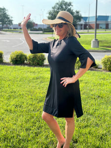 Introducing the Lulu-B Travel Dress! This dress is perfect for all your adventures with its SPF 50 fabric and quarter sleeves for sun protection. Pair it with the v-neck and side slits for a stylish and comfortable outfit. Get ready to travel in style and safety!
