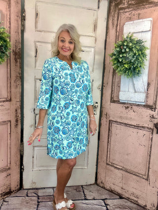 Lulu-B travel dress with SPF 50 sun protection, lightweight nylon spandex fabric, v-neckline, quarter sleeves, side slits, breathable and comfortable for travel, vacations, and everyday wear.