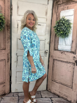 Lulu-B travel dress with SPF 50 sun protection, lightweight nylon spandex fabric, v-neckline, quarter sleeves, side slits, breathable and comfortable for travel, vacations, and everyday wear.