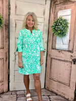 Lulu-B travel dress with SPF 50 sun protection, lightweight nylon spandex fabric, v-neckline, quarter sleeves, side slits, breathable and comfortable for travel, vacations, and everyday wear.
