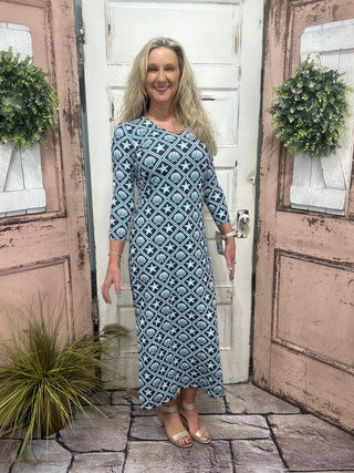 maxi dress features flattering elbow-length sleeves, a straight hemline, and UPF50+ sun protection
