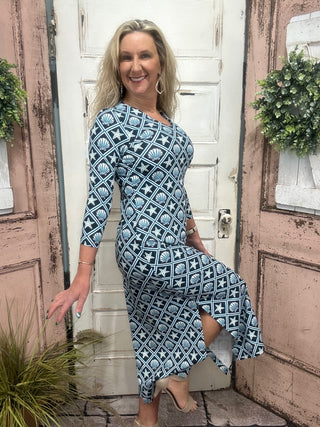 maxi dress features flattering elbow-length sleeves, a straight hemline, and UPF50+ sun protection