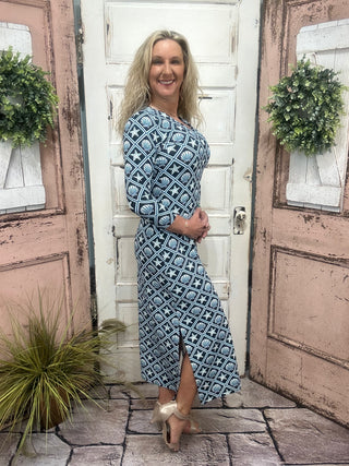 maxi dress features flattering elbow-length sleeves, a straight hemline, and UPF50+ sun protection