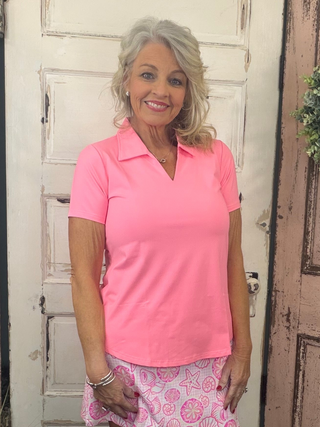 Elevate your wardrobe with the Lulu B Short Sleeve V-Neck Top with Collar, featuring butter-soft, wrinkle-free fabric that offers both luxury and practicality. This top is designed with UPF 50+ sun protection, making it a must-have for sunny days and travel. The added collar gives it a polished, sophisticated look, while the lightweight, breathable fabric ensures all-day comfort. Ideal for both casual outings and more dressed-up moments, this top packs neatly without wrinkles, so you can always look put tog