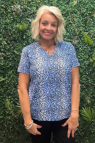 Fabric | Nylon-spandex blend — lightweight, stretchy, and breathable
Fit | Relaxed through the body
Neckline | V-neck
Sleeves | Short sleeve
Color | Blue Leopard
Sun Protection | UPF 50+
