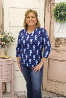 Stay cool and protected in our Lulu-B UPF50 v-neck top with 3/4 sleeves. Made with pre-shrunk, stretchy fabric and a 25" back length, it's perfect for any outing.
Navy Top with Blue Seahorses
