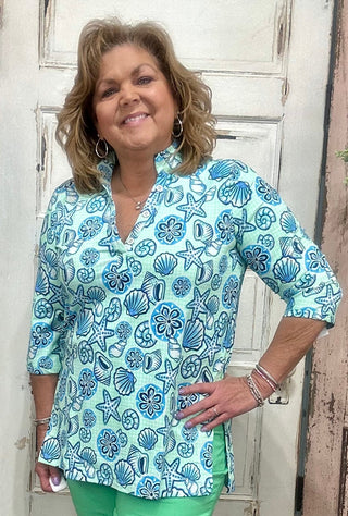 Jet set in ultimate style in the Women's V-Neck Travel Tunic Top from Lulu-B! This beautifully sleek shirt is made from a wonderfully smoothing nylon blend that will skim your curves just right, plus the fabric has UPF 50+ sun protection to keep your mind at ease on even the hottest days. A stunning v-neckline doesn't compromise on cuteness when your priority is comfort, so you'll be looking and feeling great in this tunic-length top. The vibrant colors and patterns of this adorable quarter-sleeve top add p