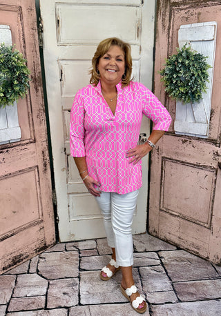 Lulu-B women’s V-neck travel tunic top with UPF50+ sun protection, nylon spandex fabric, button placket, 3/4 sleeves, straight hemline with side slits, lightweight and comfortable for travel and everyday wear.