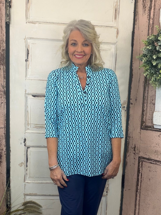 Jet set in ultimate style in the Women's V-Neck Travel Tunic Top from Lulu-B! This beautifully sleek shirt is made from a wonderfully smoothing nylon blend that will skim your curves just right, plus the fabric has UPF 50+ sun protection to keep your mind at ease on even the hottest days. A stunning v-neckline doesn't compromise on cuteness when your priority is comfort, so you'll be looking and feeling great in this tunic-length top. The vibrant colors and patterns of this adorable quarter-sleeve top add p