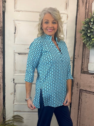 Jet set in ultimate style in the Women's V-Neck Travel Tunic Top from Lulu-B! This beautifully sleek shirt is made from a wonderfully smoothing nylon blend that will skim your curves just right, plus the fabric has UPF 50+ sun protection to keep your mind at ease on even the hottest days. A stunning v-neckline doesn't compromise on cuteness when your priority is comfort, so you'll be looking and feeling great in this tunic-length top. The vibrant colors and patterns of this adorable quarter-sleeve top add p