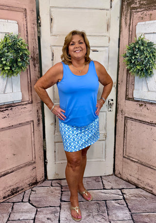 UPF50+ zip skort with pull-on waistband, lightweight A-line fit, sewn-in shorts for coverage, zip side slit, back zip pocket, front pocket, 17-inch skirt length, machine washable performance fabric.