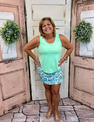 UPF50+ zip skort with pull-on waistband, lightweight A-line fit, sewn-in shorts for coverage, zip side slit, back zip pocket, front pocket, 17-inch skirt length, machine washable performance fabric.