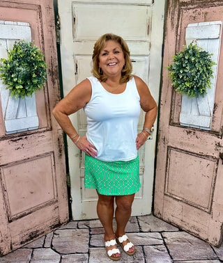 UPF50+ zip skort with pull-on waistband, lightweight A-line fit, sewn-in shorts for coverage, zip side slit, back zip pocket, front pocket, 17-inch skirt length, machine washable performance fabric.