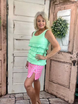 UPF50+ zip skort with pull-on waistband, lightweight A-line fit, sewn-in shorts for coverage, zip side slit, back zip pocket, front pocket, 17-inch skirt length, machine washable performance fabric.
