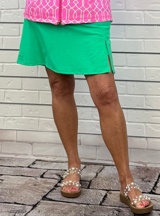 UPF50+ zip skort with pull-on waistband, lightweight A-line fit, sewn-in shorts for coverage, zip side slit, back zip pocket, front pocket, 17-inch skirt length, machine washable performance fabric.
