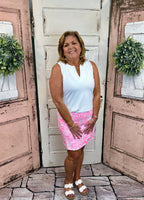 UPF50+ zip skort with pull-on waistband, lightweight A-line fit, sewn-in shorts for coverage, zip side slit, back zip pocket, front pocket, 17-inch skirt length, machine washable performance fabric.
