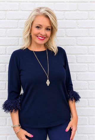 Neckline | Scoop neck
Sleeve | Elbow-length with fringe detail
Color | Navy blue
Fabric | Luxuriously soft, lightweight cashmere blend
Feel | Cozy and comfortable against the skin
Care | Follow garment care label instructions