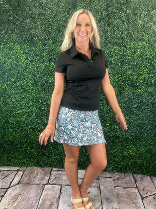 UPF50 zip skort with 2-inch pull-on waistband, A-line fit, sewn-in shorts, side zip slip, zip back pocket, small front pocket, and 17-inch length.