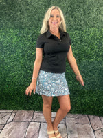 UPF50 zip skort with 2-inch pull-on waistband, A-line fit, sewn-in shorts, side zip slip, zip back pocket, small front pocket, and 17-inch length.
