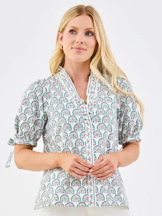 The Brynn Top is full of thoughtful, stylish details. A ruffle mock neckline and puff sleeves with elastic and tie accents add subtle charm, while the straight fit keeps it comfortable and easy to wear. A versatile top you’ll reach for again and again.

Ruffle mock neckline

Puff elastic sleeves with tie detail&nbsp;

Straight fit&nbsp;

60% Polyester / 40% Cotton