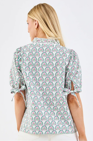 The Brynn Top is full of thoughtful, stylish details. A ruffle mock neckline and puff sleeves with elastic and tie accents add subtle charm, while the straight fit keeps it comfortable and easy to wear. A versatile top you’ll reach for again and again.

Ruffle mock neckline

Puff elastic sleeves with tie detail&nbsp;

Straight fit&nbsp;

60% Polyester / 40% Cotton