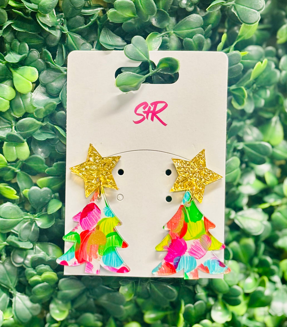 Whimsical, festive, and full of charm — our Hand-Painted Multicolor Christmas Tree Dangle Earrings are true holiday showstoppers! Topped with a shimmering gold lamé star and bursting with hand-painted color, each pair is a one-of-a-kind piece of art. No two are exactly alike, making them as unique as your holiday spirit. Lightweight, hypoallergenic, and nickel-free for all-day comfort and joy.