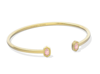 Kendra Scott Cuff Gold Bracelet 
Stone is Light Pink Opal that is lab grown