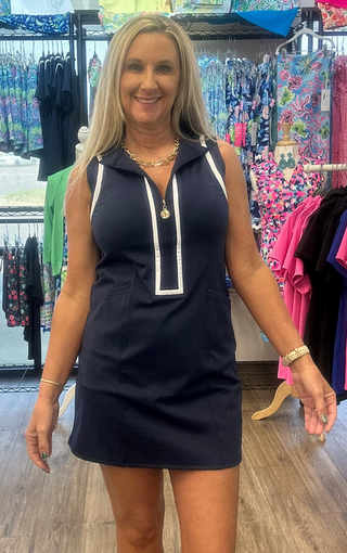 Neckline | Mid-zip mock neck with white trim
Accents | White trim along zipper and armholes/shoulders
Pockets | Two side pockets
Coverage | Includes matching under/bike shorts
Fabric | 80% Nylon, 20% Spandex — smooth, stretchy, quick-drying