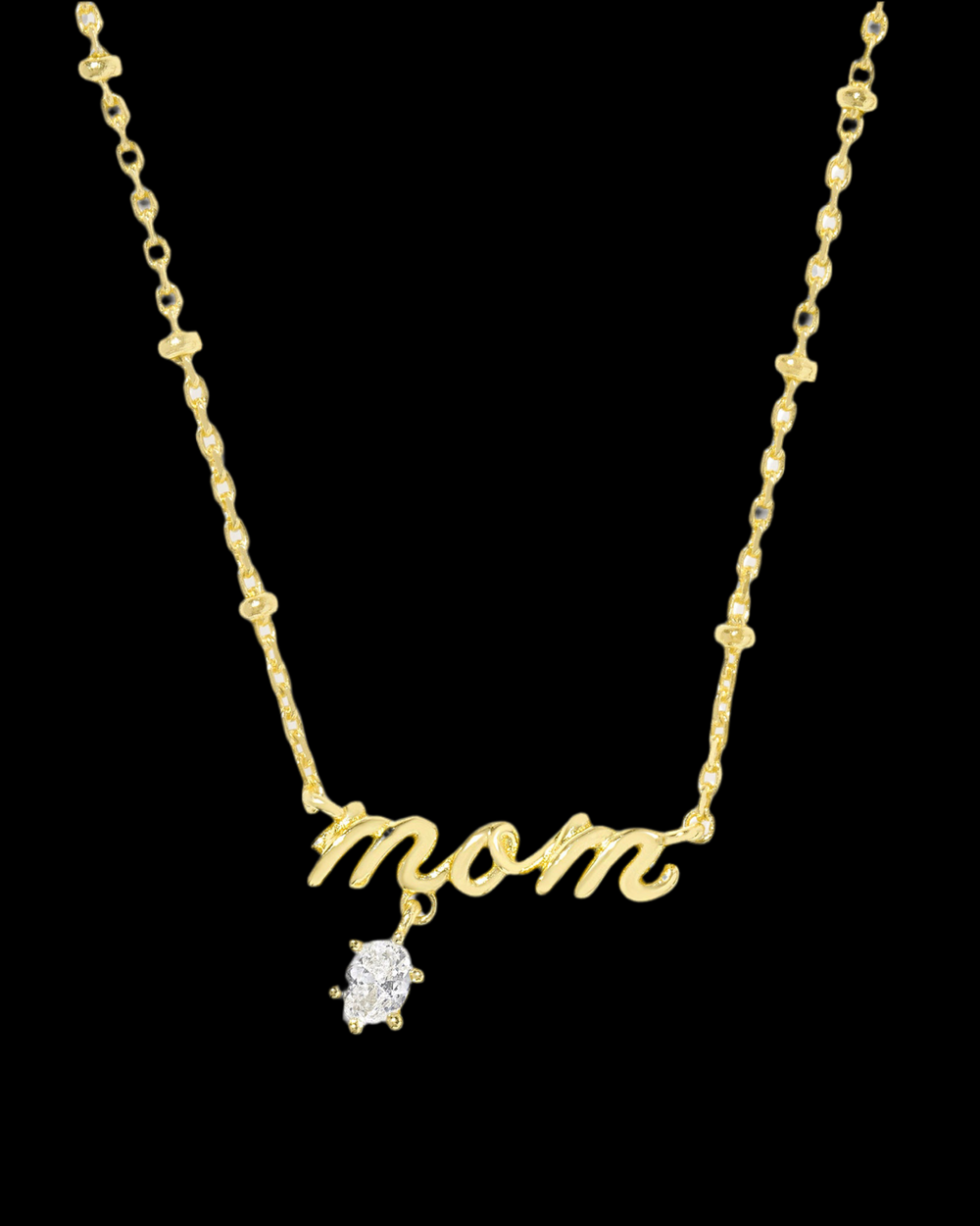 Mom Gold Crystal Short Pendant Necklace
Kendra Scott Mom Necklace
Celebrate the ones who matter most with the Mom Gold Crystal Short Pendant Necklace in White CZ. Featuring a delicate script design and subtle sparkle from white cubic zirconia, this piece is the perfect gift for any mother figure—or a sweet treat for yourself. It’s a timeless reminder of love, gratitude, and everything “Mom” means.

Details:
• Metal: Silver-tone
• Material: White Cubic Zirconia (CZ)
• Dimensions: 19