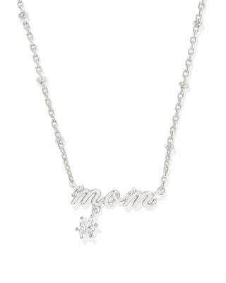 Mom Silver Crystal Short Pendant Necklace
Celebrate the ones who matter most with the Mom Silver Crystal Short Pendant Necklace in White CZ. Featuring a delicate script design and subtle sparkle from white cubic zirconia, this piece is the perfect gift for any mother figure—or a sweet treat for yourself. It’s a timeless reminder of love, gratitude, and everything “Mom” means.

Details:
• Metal: Silver-tone
• Material: White Cubic Zirconia (CZ)
• Dimensions: 19" chain, 0.17"L x 0.71"W pendant