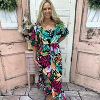 Experience the luxurious comfort & style of our Gentry Midi Dress! This dress boasts a square neckline, short balloon sleeves & a flounce hem.