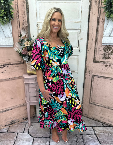 Experience the luxurious comfort & style of our Gentry Midi Dress! This dress boasts a square neckline, short balloon sleeves & a flounce hem.