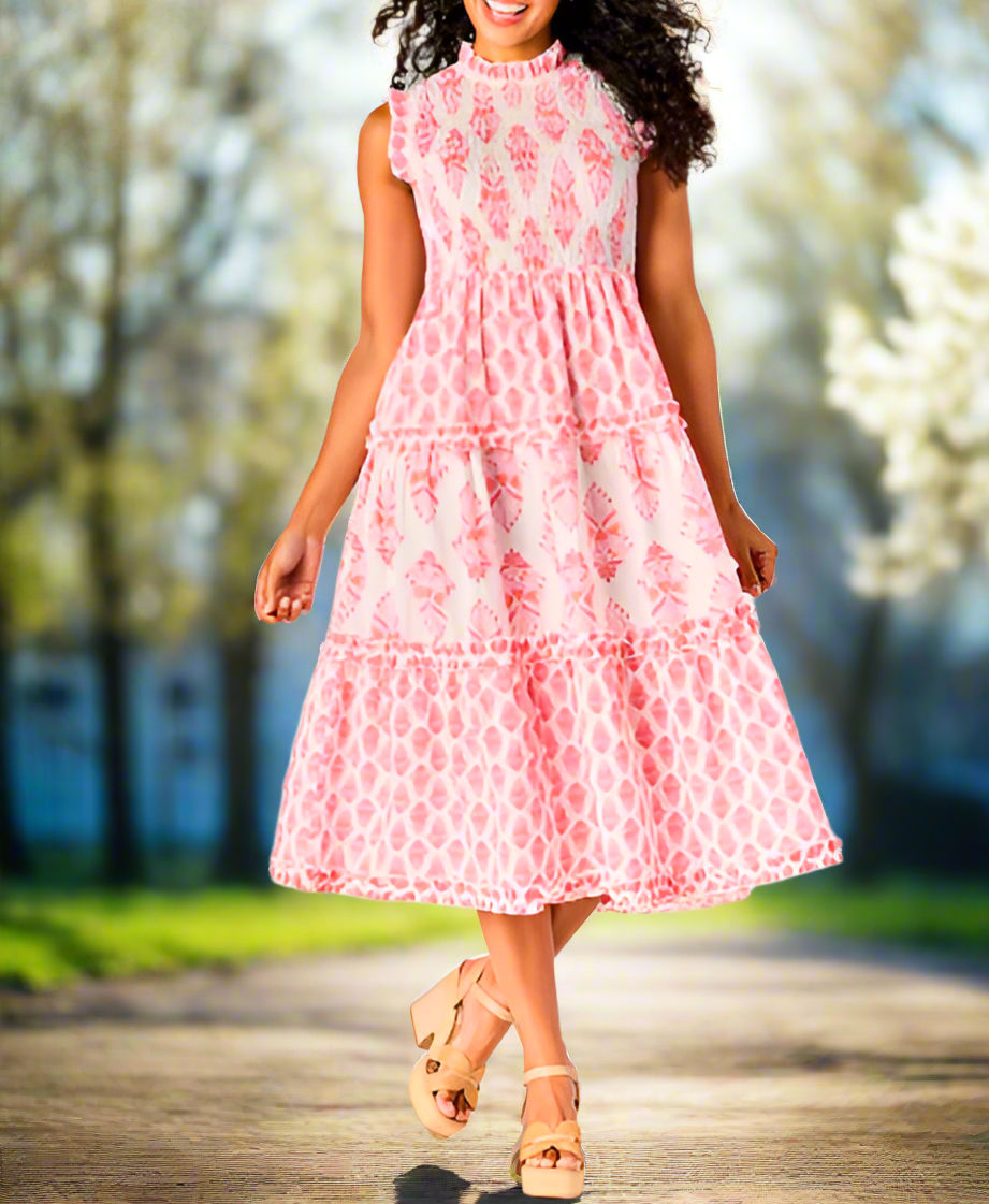 Cotton cambric midi length dress with smocked bodice features ruffle shoulders, neckline and skirt tiers